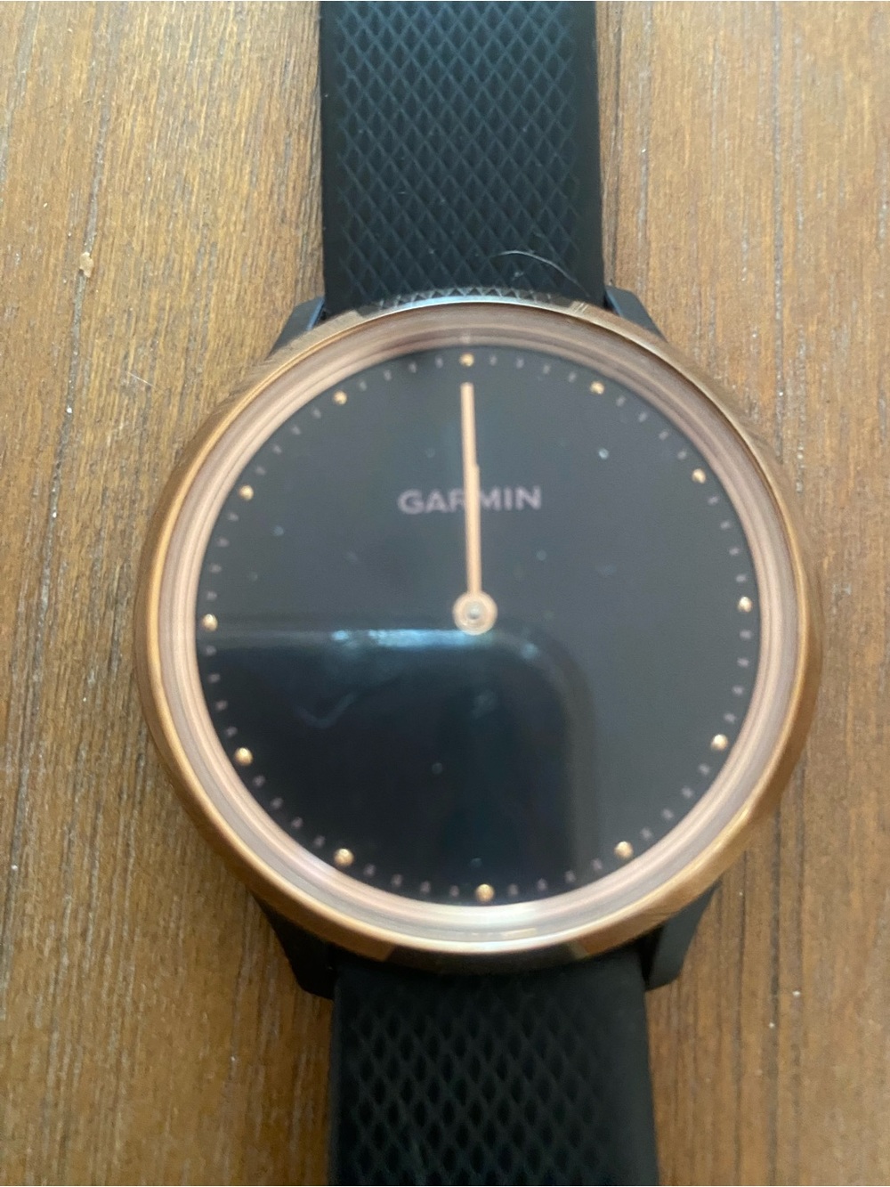 Garmin black smartwatch with rose gold bezel